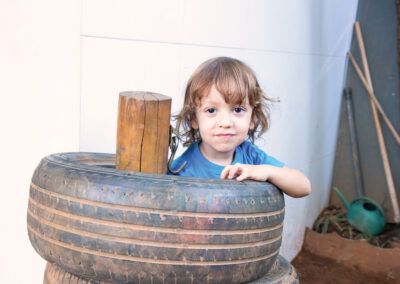 A young boy plays in outdoor playground.